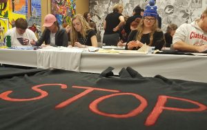 Students paint shirts to bring awareness to domestic violence