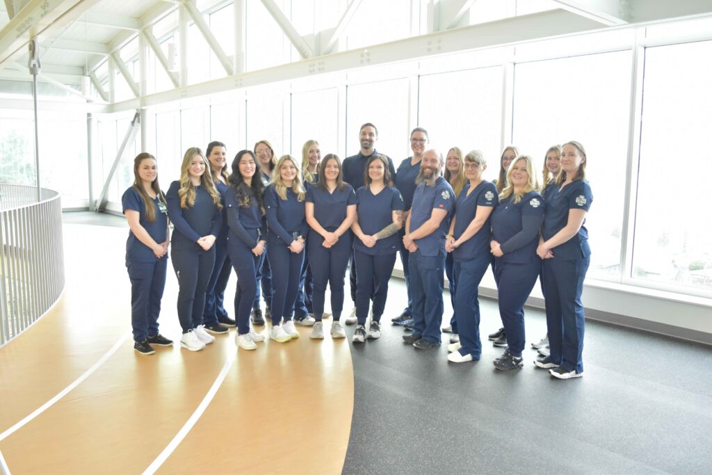 nursing student graduates of 2024 pose in their scrubs